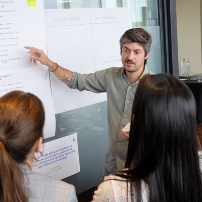 Man pointing on a white board
