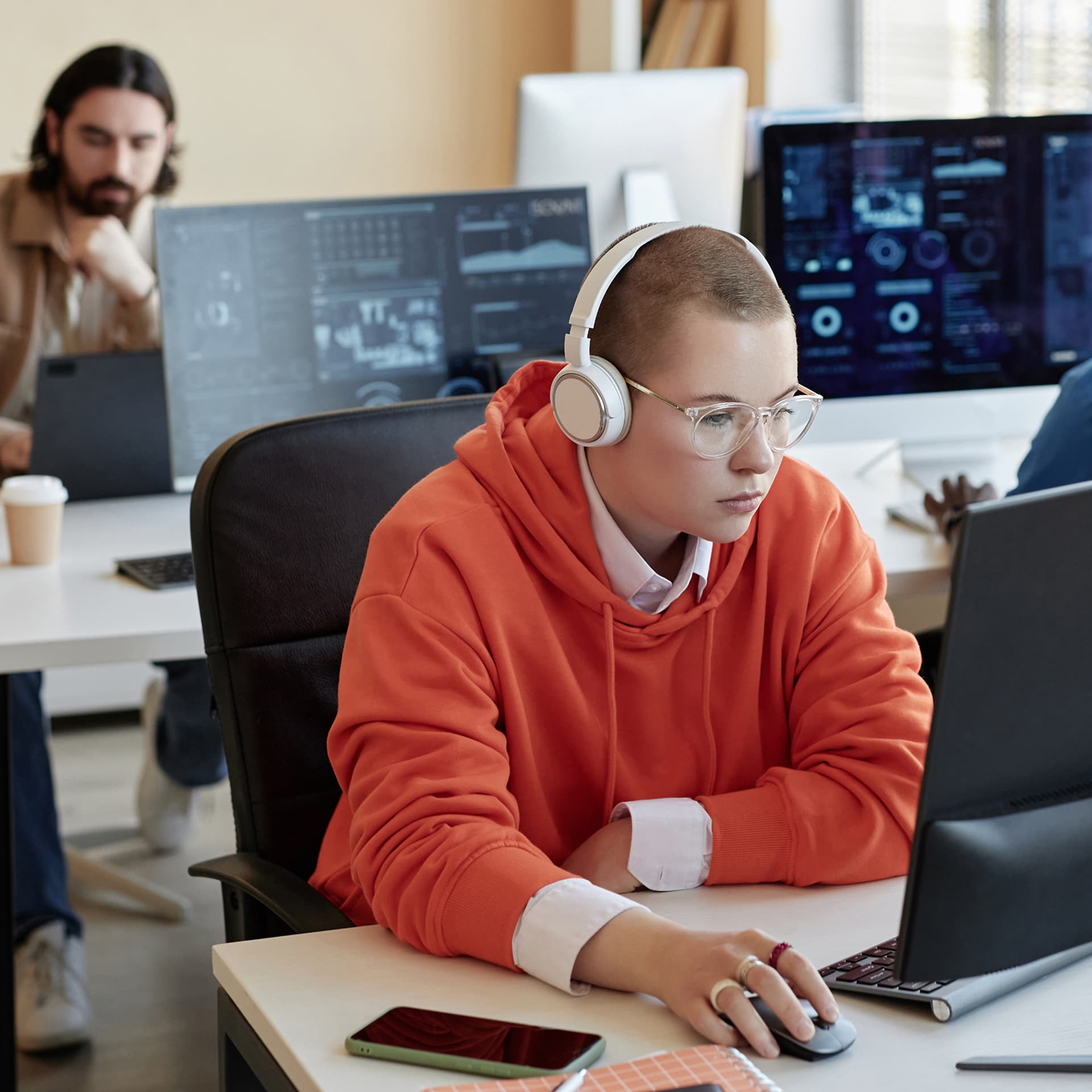 IT specialist using ServiceNow AI Blueprint for Issue Auto Resolution in a modern tech office.