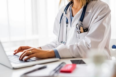doctor working on laptop