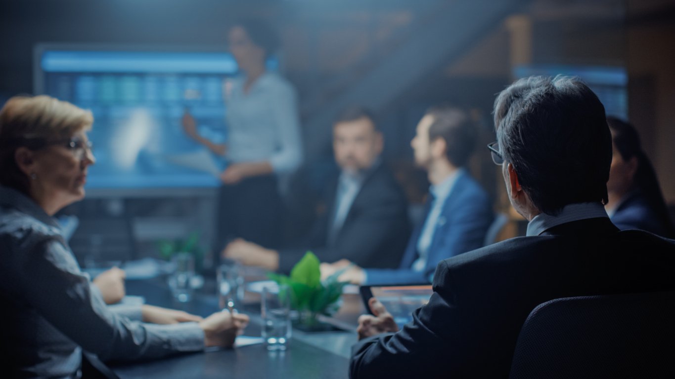 People sitting in a meeting room doing cyber exercise