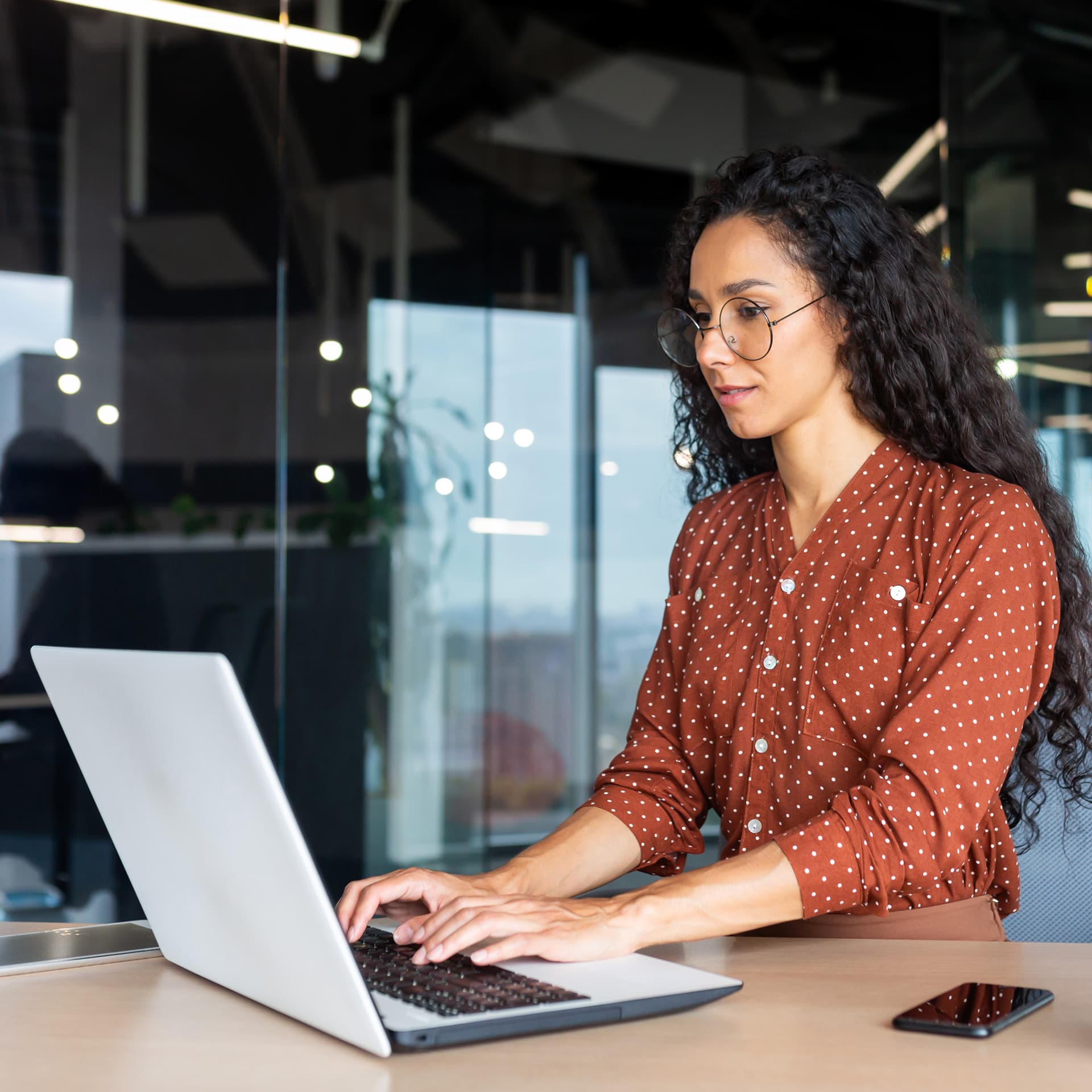Woman in front of the laptop.