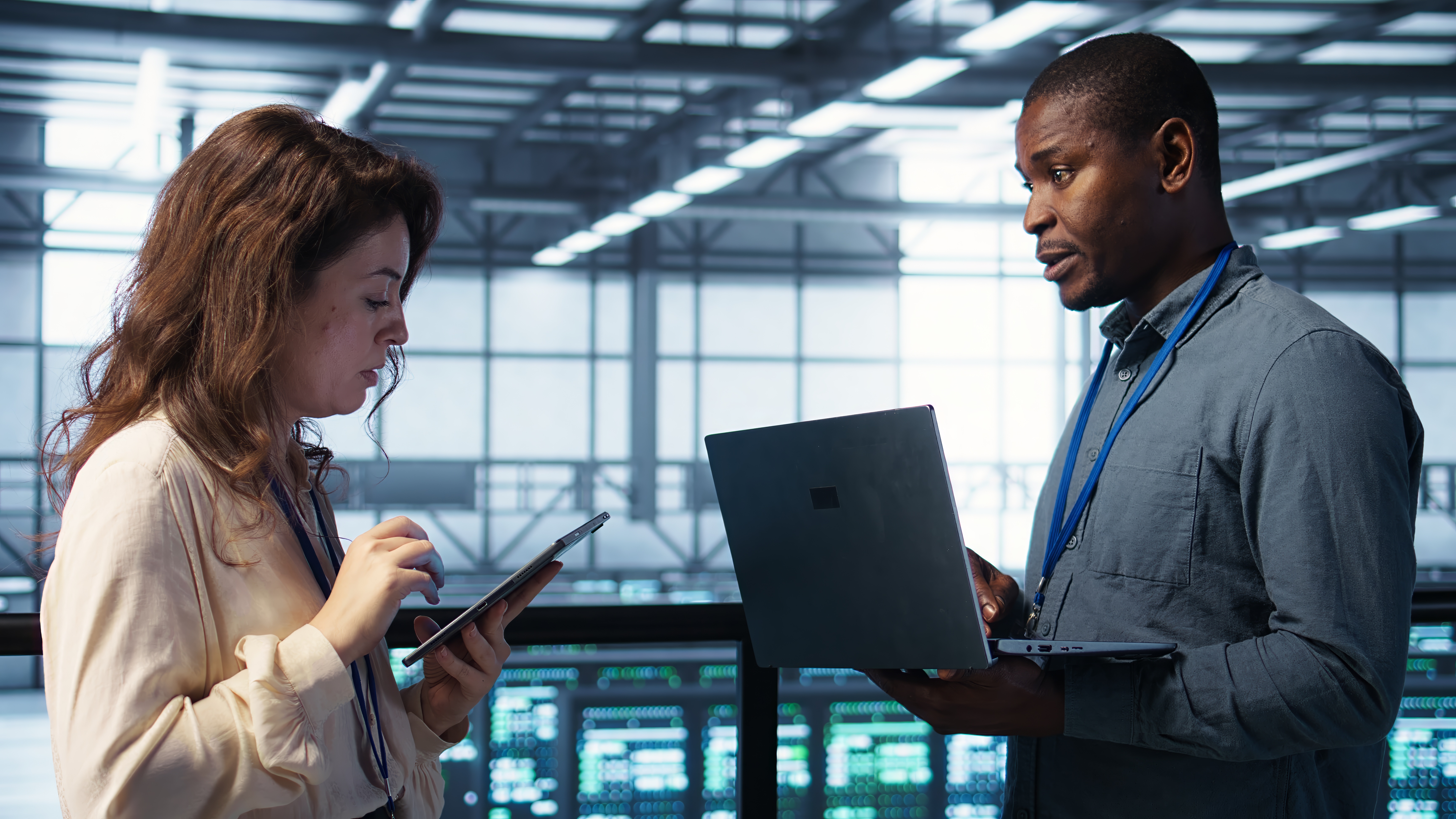 team-technicians-working-server-farm-using-laptops-analyze-data