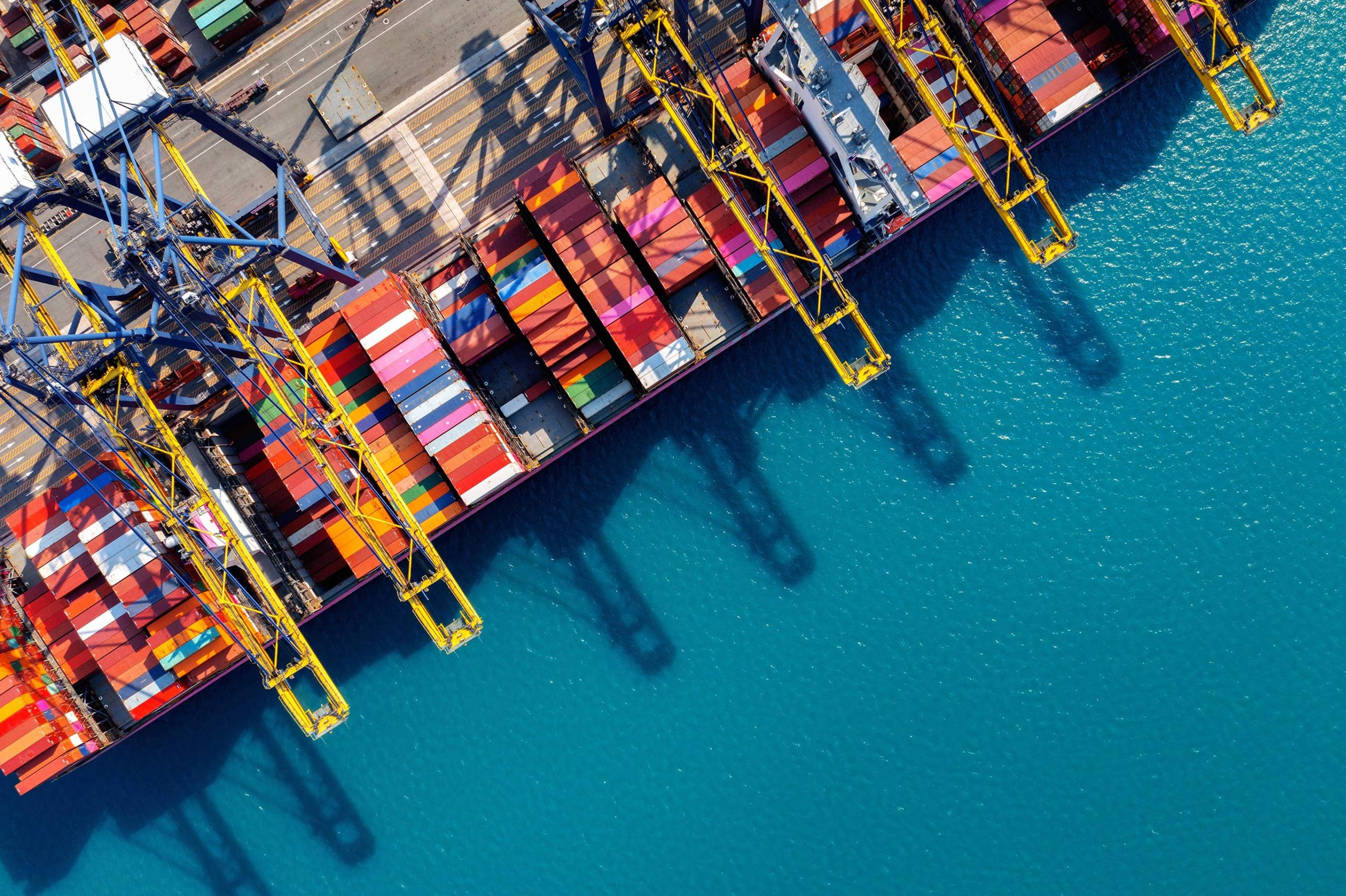 aerial view of cargo ship and cargo container in harbor