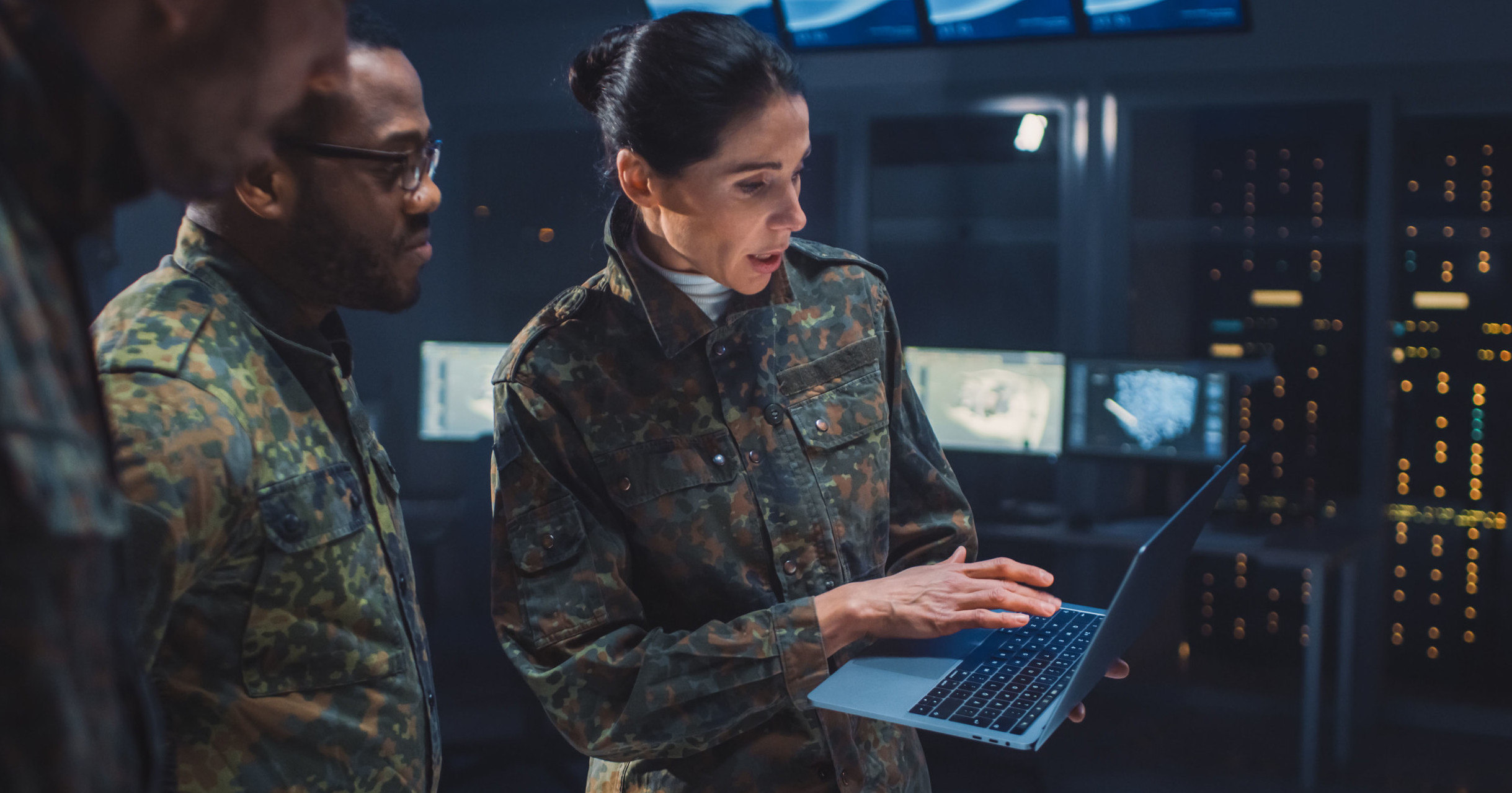 Cyber resilience demonstrated by female military officer to two male officers