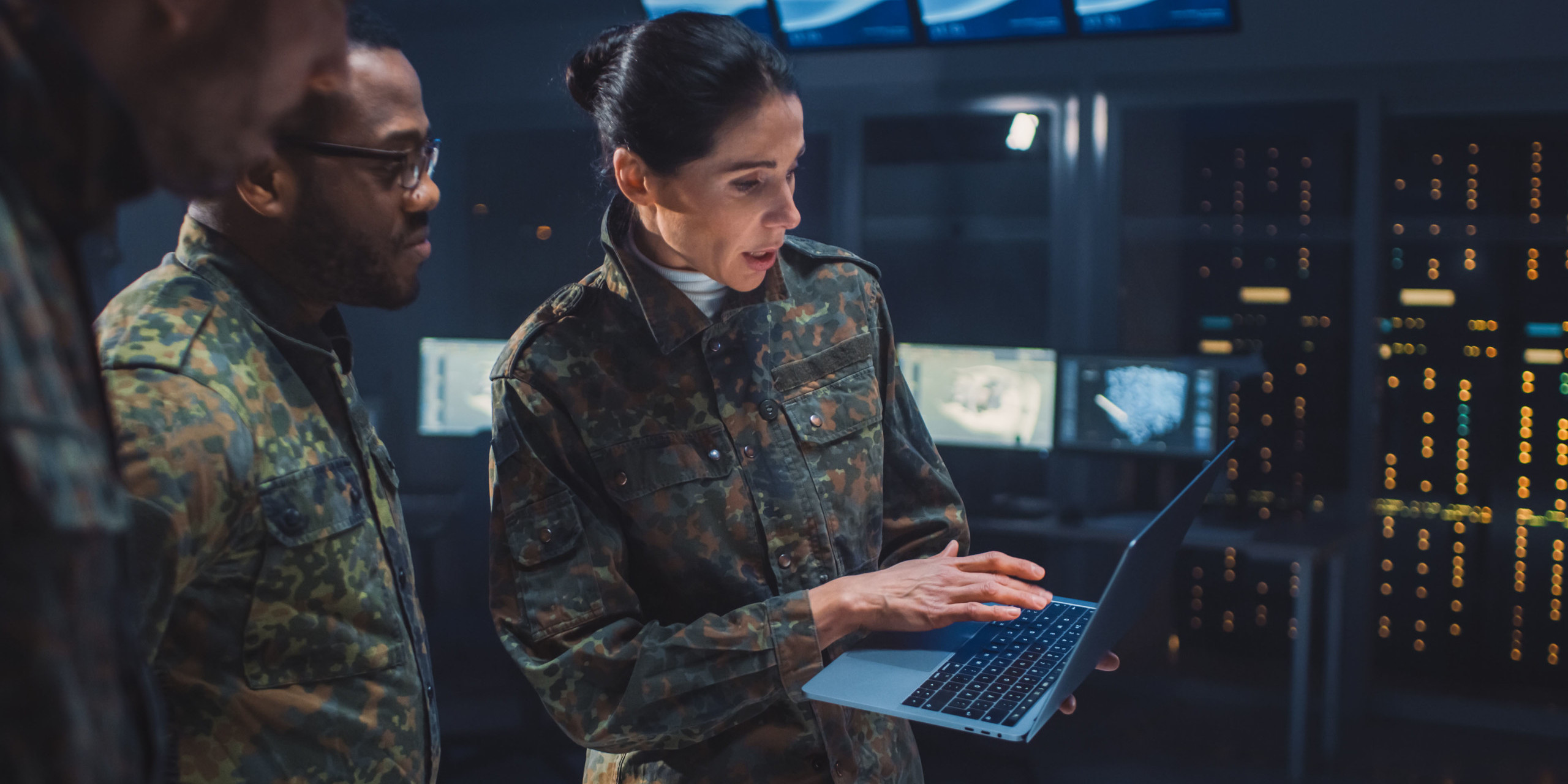 Cyber resilience demonstrated by female military officer to two male officers