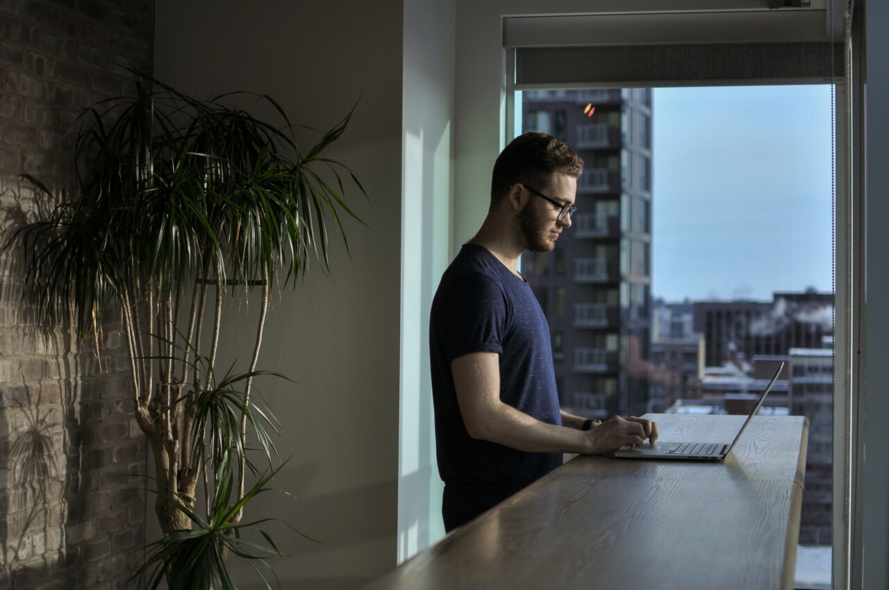 Man at home with laptop browsing public services