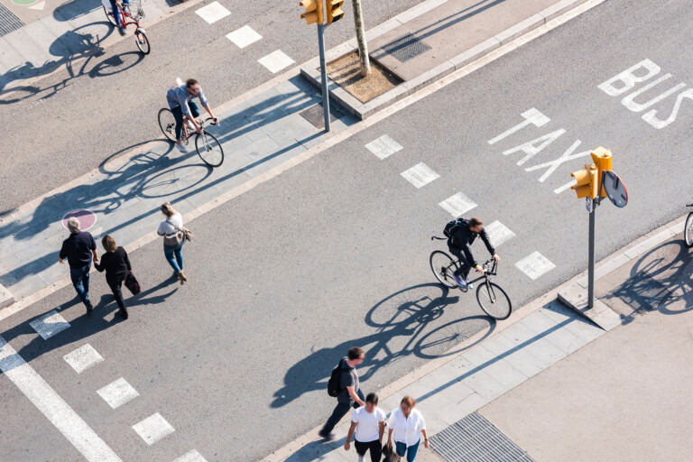 People crossing street Cycling and Walking Traffic sign Smart city Urban lifestyle outdoor