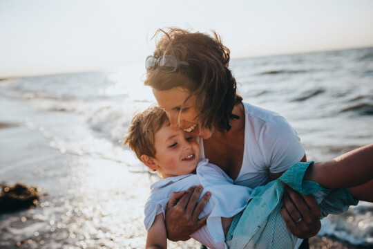 woman and child by the sea